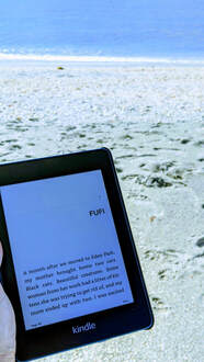 Kindle with the beach in the background